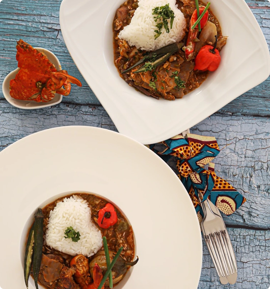 Two plated rice and seafood meals